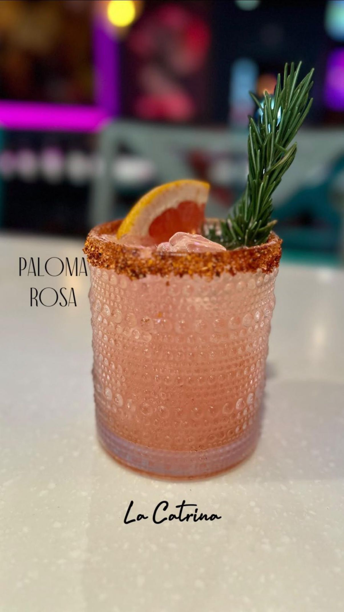 Paloma Rosa — pink cocktail with a tajín-style rim, grapefruit and rosemary